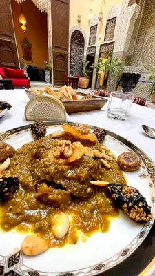 a plate of food sitting on a table at Riad Moulaydriss et Giacomo in Fès