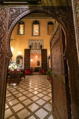 an open door to a room with a tile floor at Riad Moulaydriss et Giacomo in Fès