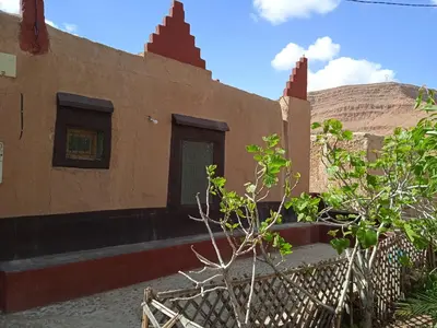 a building with a fence in front of it at Dar Jamila in Achbarou