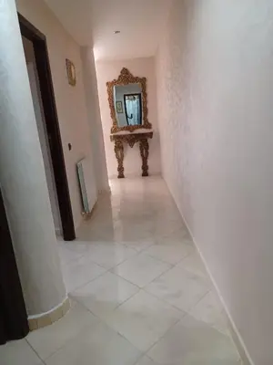 a hallway with a mirror and a tiled floor at The Orchard Comfy & Cozy Apartment 2 in Ifrane