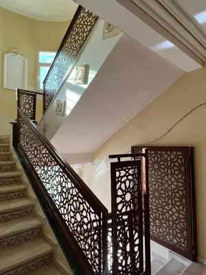 a set of stairs with wrought iron railings at Stunning 3-Bed Villa in Fes near fes sais airport in Fès