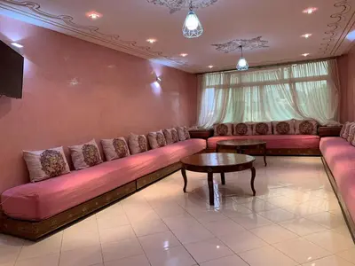 a living room with a couch and a table at Stunning 3-Bed Villa in Fes near fes sais airport in Fès