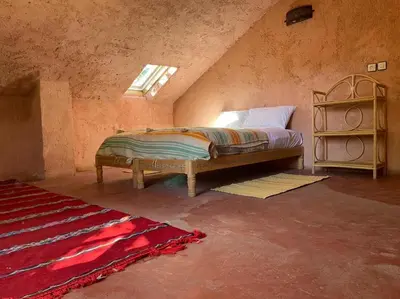 a bedroom with a bed in an attic at Gîte Camping Amazigh in Azrou