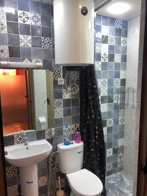 a bathroom with a toilet and a sink at Chez ZAKARIA de Lyon in Meknès