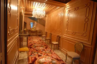 a long table in a room with chairs and a chandelier at Résidence Ifrane Palace in Ifrane