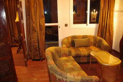 a living room with a couch and a chair at Résidence Ifrane Palace in Ifrane