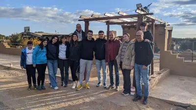 a group of people posing for a picture at Café restaurante shelter calm life in Bou Dib