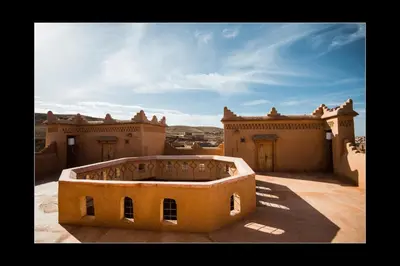 a view of a building in the desert at Casbah d'hôte La Jeanne Tourisme Ecologique in Boumalne