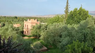 an aerial view of a house surrounded by trees at Le Beau Site Ourika in Aghmat