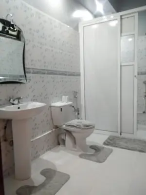a bathroom with a sink and a toilet and a shower at Villa Eden in Ouarzazate