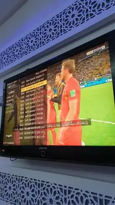 a television screen with a soccer game on it at Maison GHITA in Azrou