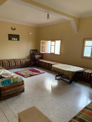a large living room with couches and a table at Ferme fes in Fès