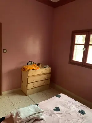 a bedroom with a bed and a window at Ferme fes in Fès