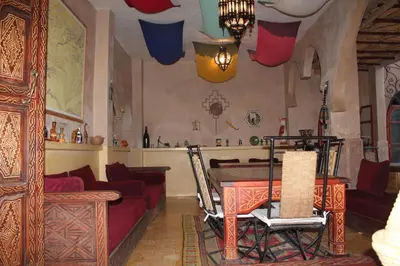 a living room with a couch and a table at Dar Amazir in Agdz