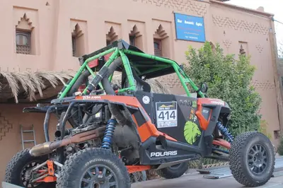 an atv parked in front of a building at Dar Amazir in Agdz