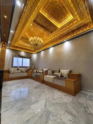 a living room with a couch and a gold ceiling at ZR Comfort Delux in Fès