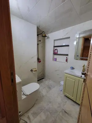 a bathroom with a toilet and a tub and a sink at ZR Comfort Delux in Fès