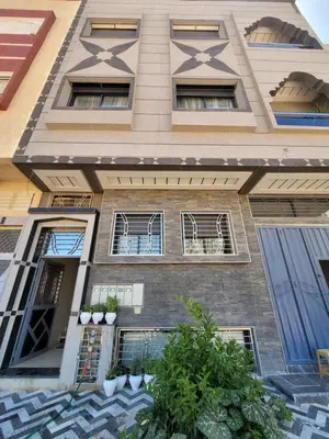 a tall building with windows and plants on it at ZR Comfort Delux in Fès
