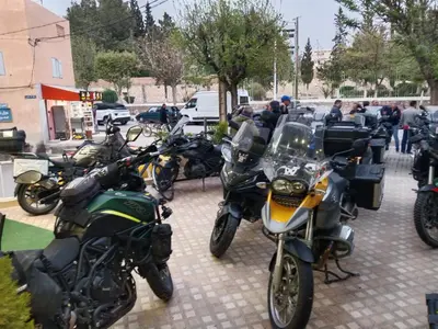 a group of motorcycles parked on a sidewalk at Hôtel Imilchil in Midelt