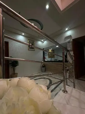 a large mirror on a wall in a room at Hôtel Imilchil in Midelt