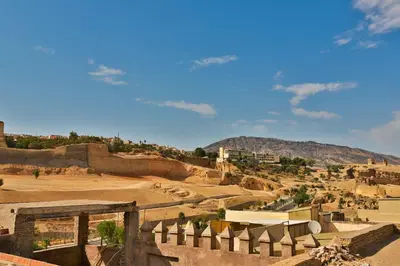 a view of a village with a mountain in the background at Riad Dar Jeanne in Fès
