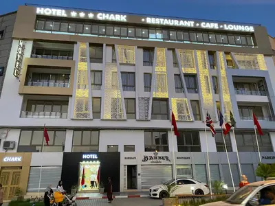 a building with lights on the front of it at HOTEL CHARk in Guercif