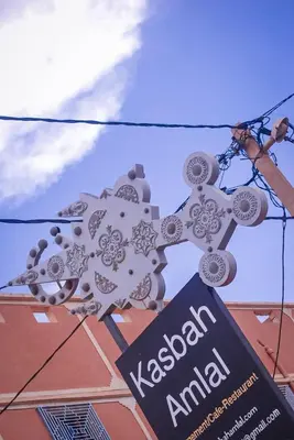 a sign for a kazakhstan embassy with a sign in front at kasbah amlal in Boumalne