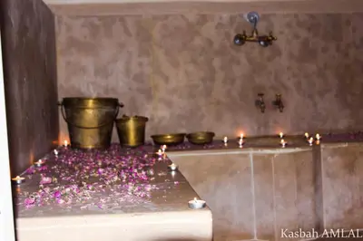 a altar with candles and gold buckets in a room at kasbah amlal in Boumalne