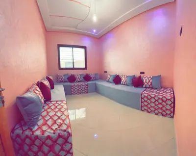a living room with two couches in a room at Dar Al Montazah in Meknès
