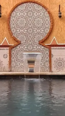 a wall with water coming out of it at Riad Parfums de OUARZAZATE in Ouarzazate