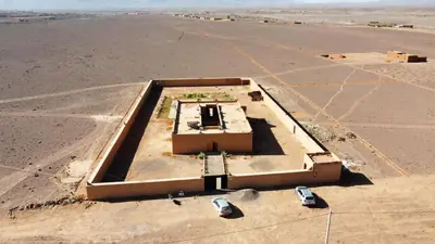 an aerial view of a building in the middle of a desert at Tigmi Timhar in Tafrourht nʼAït Bou Jijou