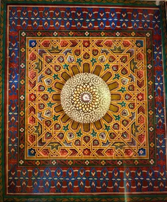 a painting of a flower on a ceiling at Riad Dar Kassim in Fès