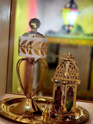 a tea kettle and a lantern on a table at Riad Dar Kassim in Fès