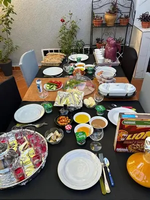 a table with plates of food on it at Dar el kebira in Meknès