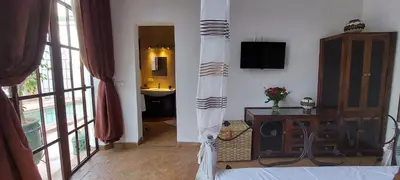 a bedroom with a bed in a room at Riad Ramzi in Marrakech
