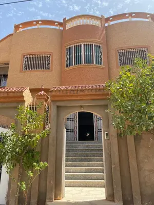 a building with stairs leading to a door at Appartement Villa Rayhana in Khenifra