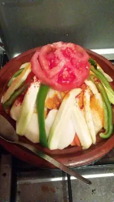 a plate of food with a tomato on top at Auberge Chez Bassou Agoudal in Agoudal