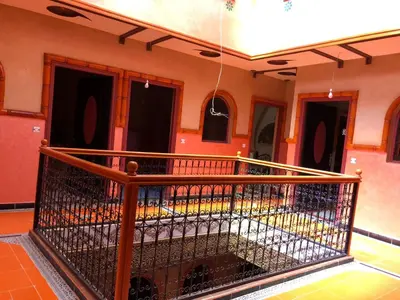 a balcony with a metal fence in a building at Hotel Restaurant Hollywood Africa in Aït Ben Haddou