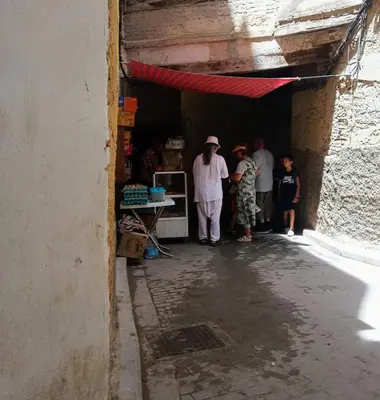 a group of people standing inside of a building at Riad Rchacha in Fès