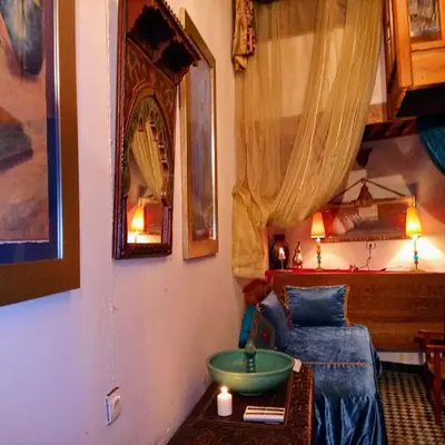 a room with a bed and a green bowl on a table at Riad Rchacha in Fès