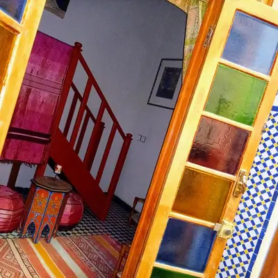 an open door to a room with a staircase and a stair case at Riad Rchacha in Fès