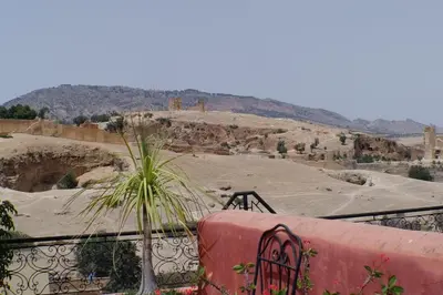 a view of a desert from a balcony with a plant at Riad Layalina Fes 7 Chambres & 18 Personnes Piscine, Parking, Vue & Wifi au Pied Medina in Fès