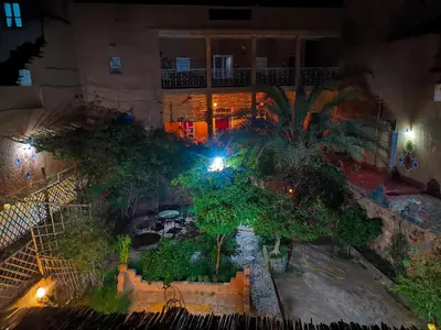 an overhead view of a courtyard at night at Riad Dar Zaouia in Zagora
