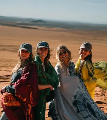 a group of women standing in the desert at Maggaman Guest House in Tafraoute Sidi Ali