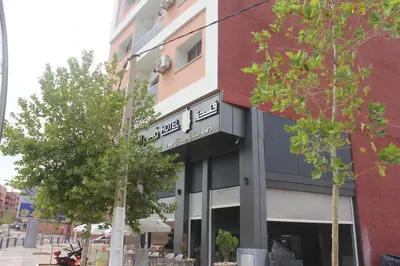 a building with a sign on the front of it at HOTEL CAFE PALAIS SALAM , Beni Mellal in Beni Mellal