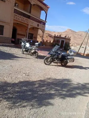 two motorcycles parked in front of a building at Kasbah Tialouite in Kalaat MGouna