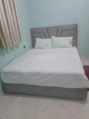 a bed with white sheets and pillows in a room at The good stay 3 in Midelt
