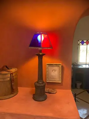 a lamp sitting on top of a table with a keyboard at RIAD CHANT D'ETOILES tadighoust in El Hara