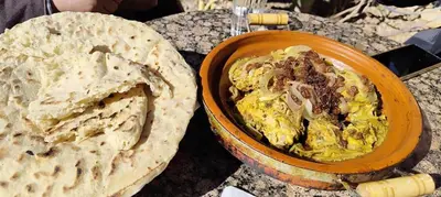 a bowl of food on a table with a pie at Auberge IMIN TAGHYA in Akhendachou nʼAït Ouffi