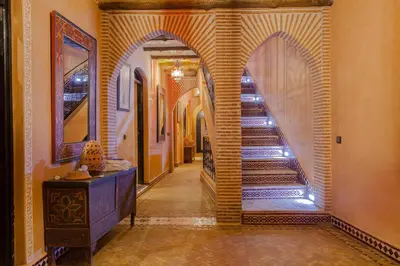 a hallway with a staircase in a house at Dar Ikalimo Ourika in Aghbalou
